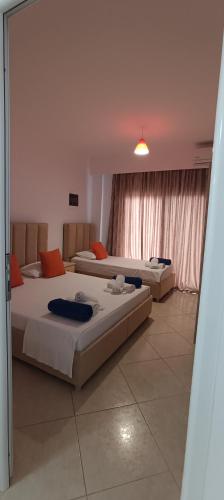 a bedroom with two beds in a room at Villa Nefeli Ksamil in Ksamil