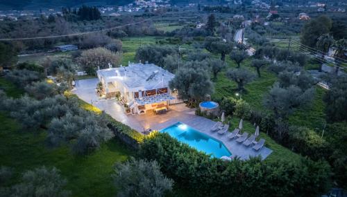 an aerial view of a house with a swimming pool at Villa Andreas A Private Paradise in Mouzákion