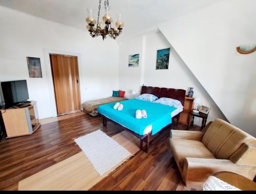 a living room with a bed and a couch at River Side Belgrade in Sajmište