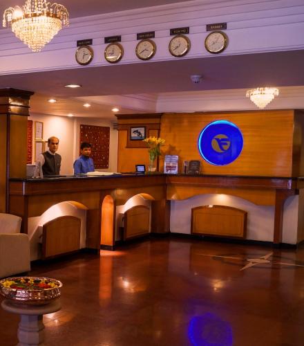 a bar in a hotel with a man standing at a counter at Fortune Park Galaxy, Vapi - Member ITC Hotels' Group in Vapi