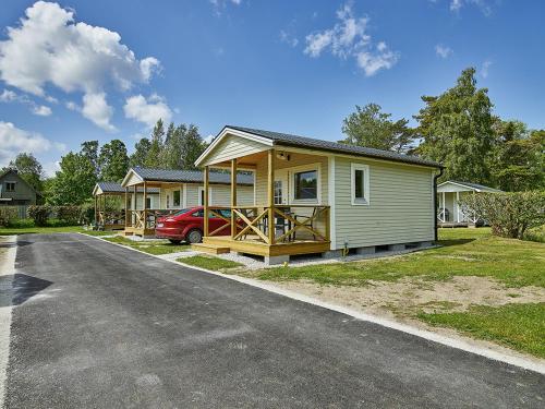 a house with a car parked in front of it at Sudersand Resort in Fårö
