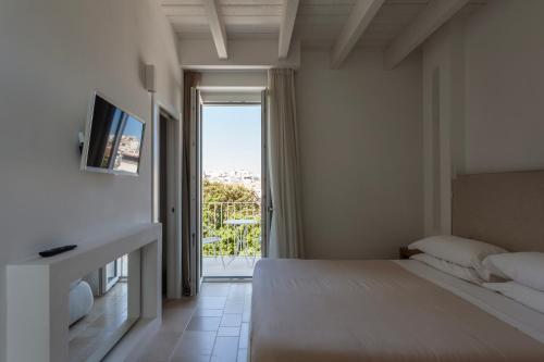 a bedroom with a bed and a window with a view at Tra Cielo e Mare in Vieste