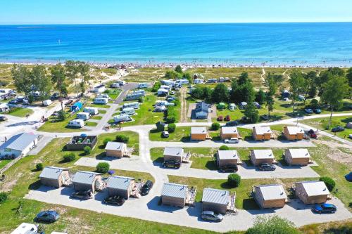 an aerial view of a parking lot next to the beach at Sudersand Resort in Fårö