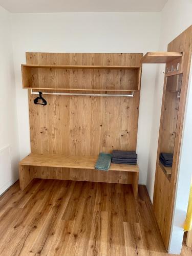 a room with a wooden bench in a room at Hotel Lercher in Sankt Veit im Pongau