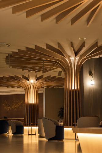 a lobby with wooden beams on the ceiling at The Archipelago in Toucheng