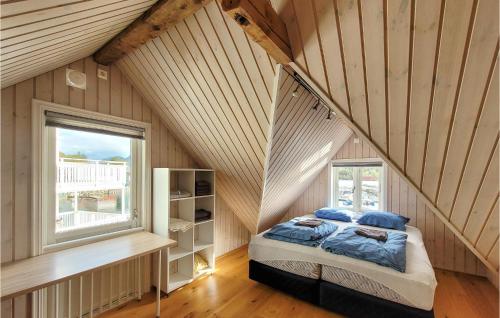 a bedroom with a bed in a attic at 4 Bedroom Awesome Home In Strandvik 