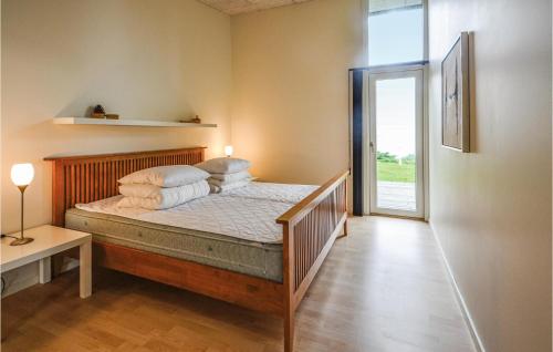 Postelja oz. postelje v sobi nastanitve Stunning Home In Roslev With 3 Bedrooms And Sauna