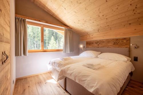 Letto o letti in una camera di SWISSPEAK Resorts Zinal