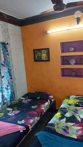 Ένα ή περισσότερα κρεβάτια σε δωμάτιο στο Honey Palace Homestay