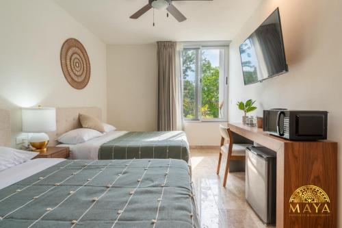 Ένα ή περισσότερα κρεβάτια σε δωμάτιο στο NHOA 309C Lux 1BR Condo Pool View in Aldea Zama