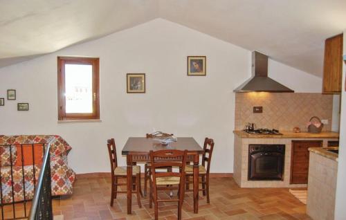 a kitchen and dining room with a table and chairs at Casa Sol in Casole dʼElsa