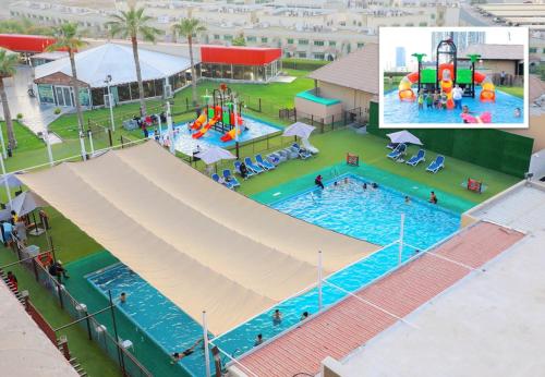 an overhead view of a swimming pool at a resort at Ras Al Khaimah Hotel in Ras al Khaimah