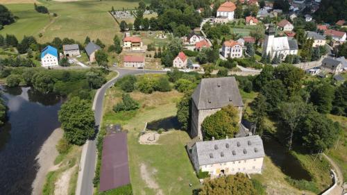 an aerial view of a small town with a building and a river at Pod Wieżą u Kory in Siedlęcin