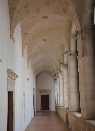 an empty hallway in a building with a ceiling at Casa Valerio in Conversano