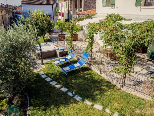 a playground with a slide in a yard with trees at Ca'Lisel in Valdobbiadene