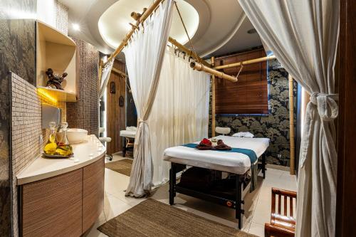 a bathroom with a tub and a sink and a shower at Hotel Galicja Wellness & SPA in Oświęcim