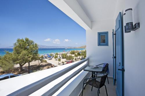 a balcony with a view of the ocean at Naxos Colosseo in Agios Prokopios
