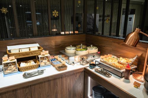 a buffet line with many different types of food at Spring Rhapsody Hotel in Taichung