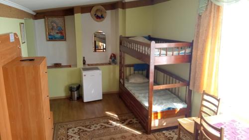 a bedroom with two bunk beds in a room at Coffee Hostel in Lviv