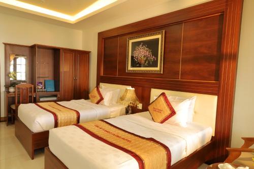 Pleiku Hotel by Gia Lai Touristにあるベッド