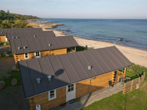 an overhead view of a house with solar panels on the beach at 6 person holiday home in Allinge in Allinge