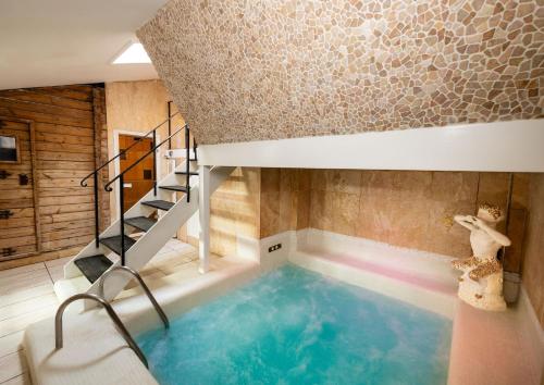 a swimming pool in a house with a staircase at Spa Retreat in Portsmouth