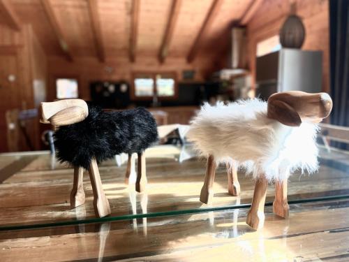three stuffed animals on top of a glass table at Chalet 4C in Les Houches