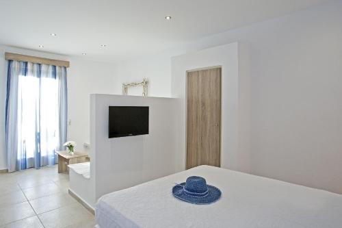 Кровать или кровати в номере Naxos Colosseo