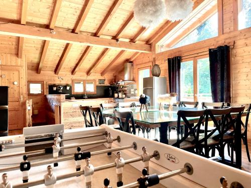 a kitchen and dining room with a table and chairs at Chalet 4C in Les Houches