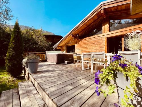 a wooden deck in front of a house at Chalet 4C in Les Houches