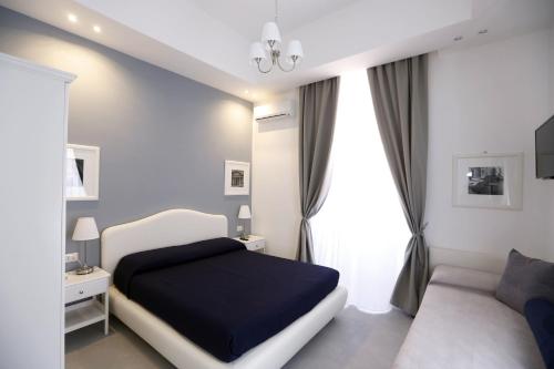 Postel nebo postele na pokoji v ubytování Rome Together Guest House