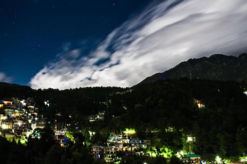 a view of a city at night at The Bougainvillea, Mcleodganj in Dharamshala
