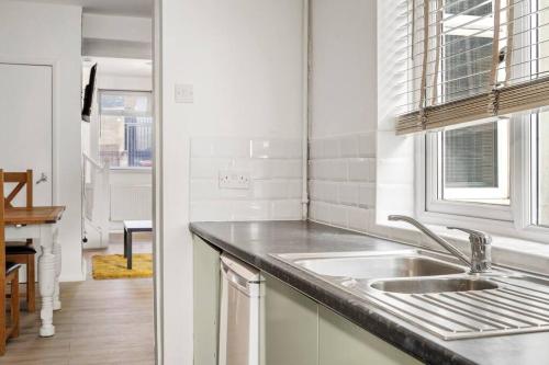 a kitchen with a sink and a counter top at Hoan Place in Strood