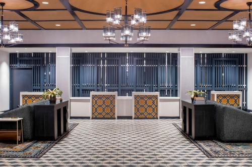 a lobby of a hotel with chandeliers at Hyatt Centric French Quarter New Orleans in New Orleans