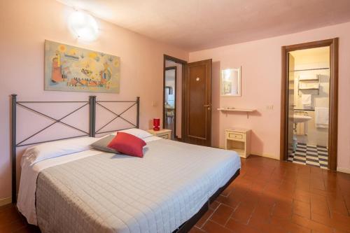 a bedroom with a large bed in a room at Villino Stregatta by VacaVilla in Fucecchio