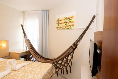 Postel nebo postele na pokoji v ubytování Confortável Flat Na Praia