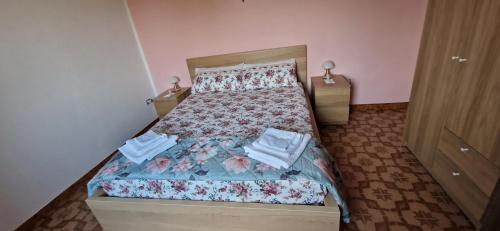 Ένα ή περισσότερα κρεβάτια σε δωμάτιο στο B&B NINA