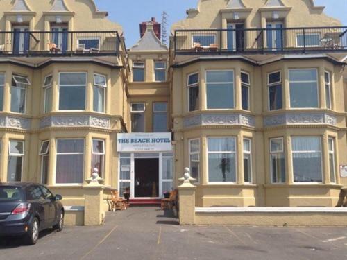 a car parked in a parking lot in front of buildings at The waterfront hotel in Blackpool