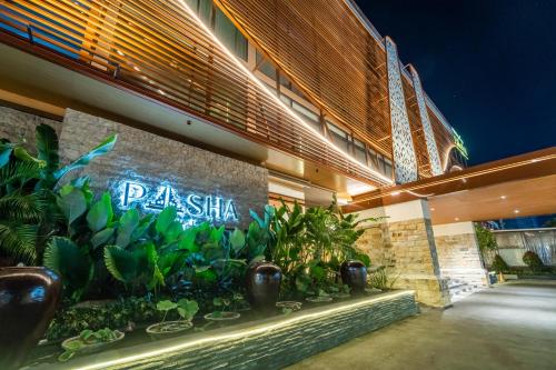 a building with a sign that reads paska at Cross Vibe Paasha Atelier Bali Kuta in Kuta