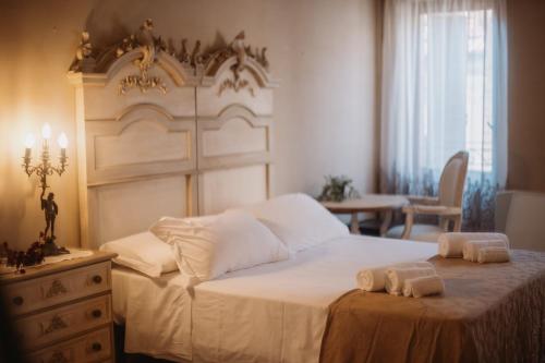 Hotel Oviv dimora del borgoにあるベッド