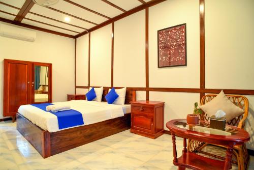Кровать или кровати в номере Densy Angkor Bungalow