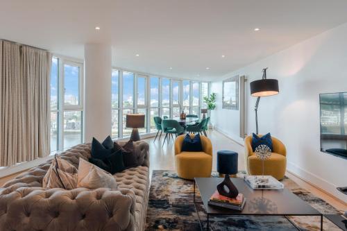 a living room with a couch and chairs at BEST THAMES VIEW in TOWN! LARGE LUXXE NOMAD DESIGN FAMILY HOME in London