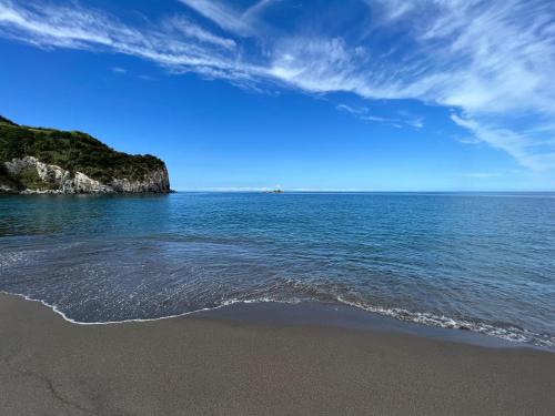 vista sull'oceano con una spiaggia sabbiosa di Super Mário Houses - Casa dos Moinhos a Porto Formoso