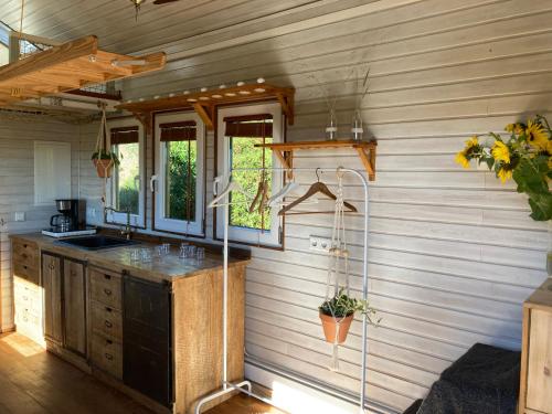 a kitchen with a sink and a counter top at Jardim Dos Mil Gostos Covões in Sertã