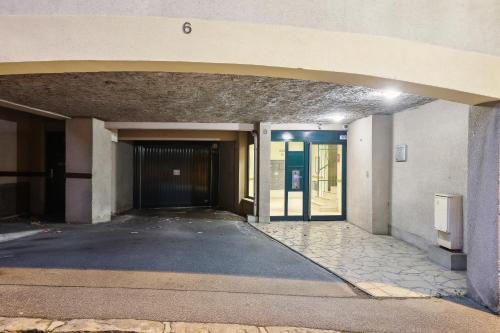 an entrance to a building with a door and a hallway at Chic apart duplex with parking in Palaiseau