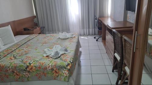 Un ou plusieurs lits dans un hébergement de l'établissement Ponta Negra Flat