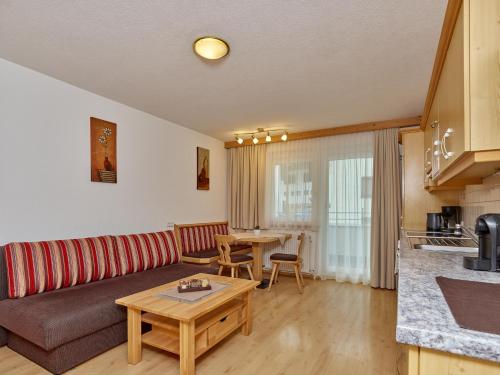 a living room with a couch and a table at Apart Albert in Ischgl