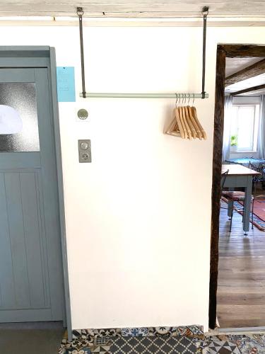 a door leading into a room with a table at Ganze Wohnung - Erdgeschoss - sehr ruhig - Hundefreundlich - Regendusche - Bodenheizung - Küche - easy Check-in mit Schlüsselbox in Nehren