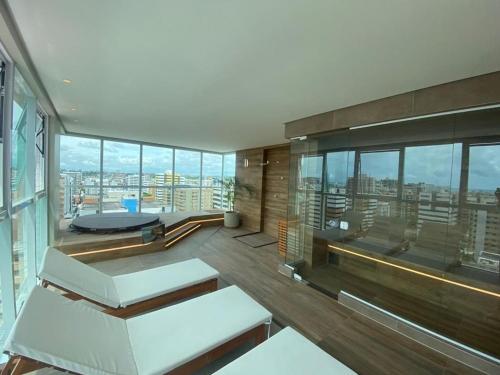 Posezení v ubytování Edifício Promenade II Apt 306-Mandi Hospitalidade