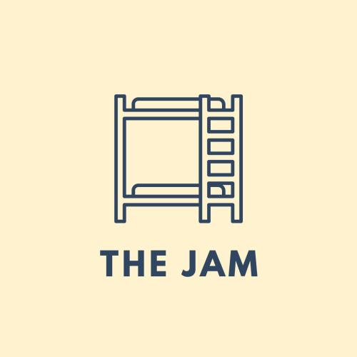 a sign that reads the jam with a ladder at The Jam Hostel Luang Prabang in Luang Prabang